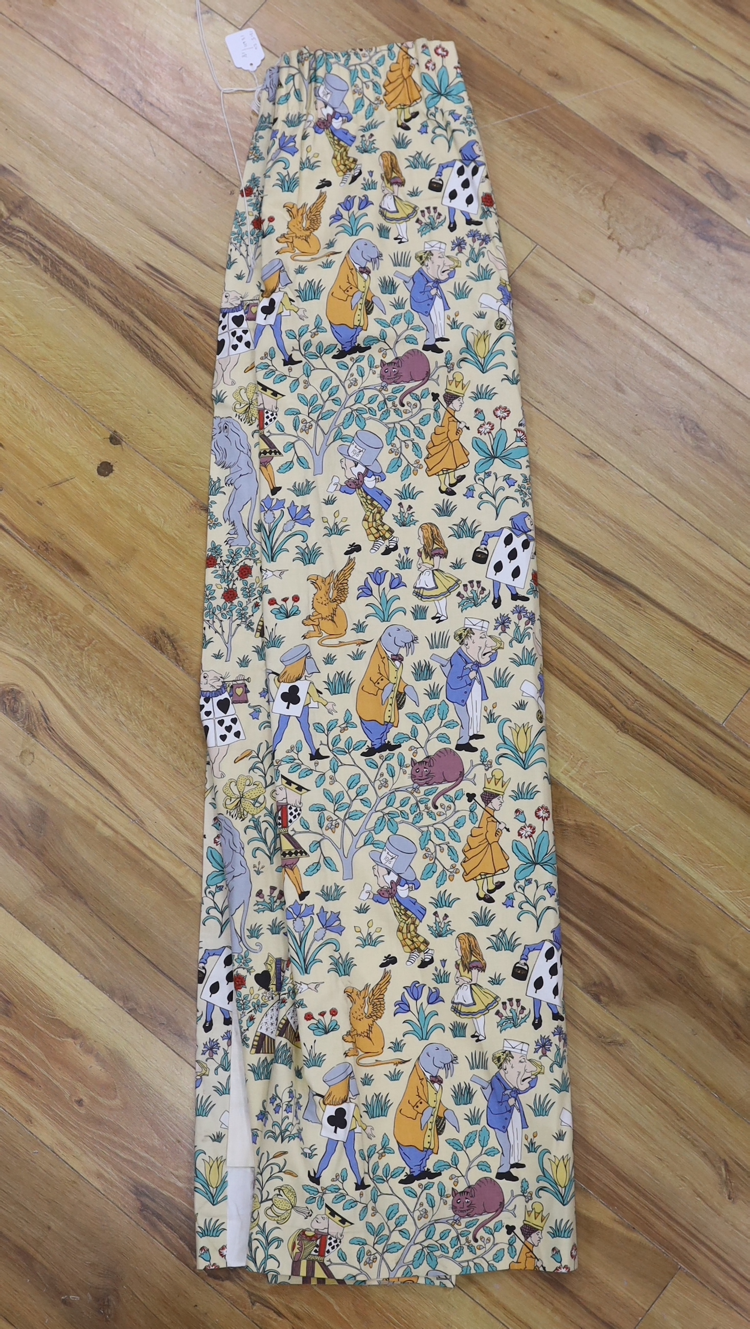 A late 1980’s vintage curtain of Alice in Wonderland, design originally by C. F. A. Voysey; selvage printed; The Habitat V&A collection, 130cm wide at the bottom, 130cm long